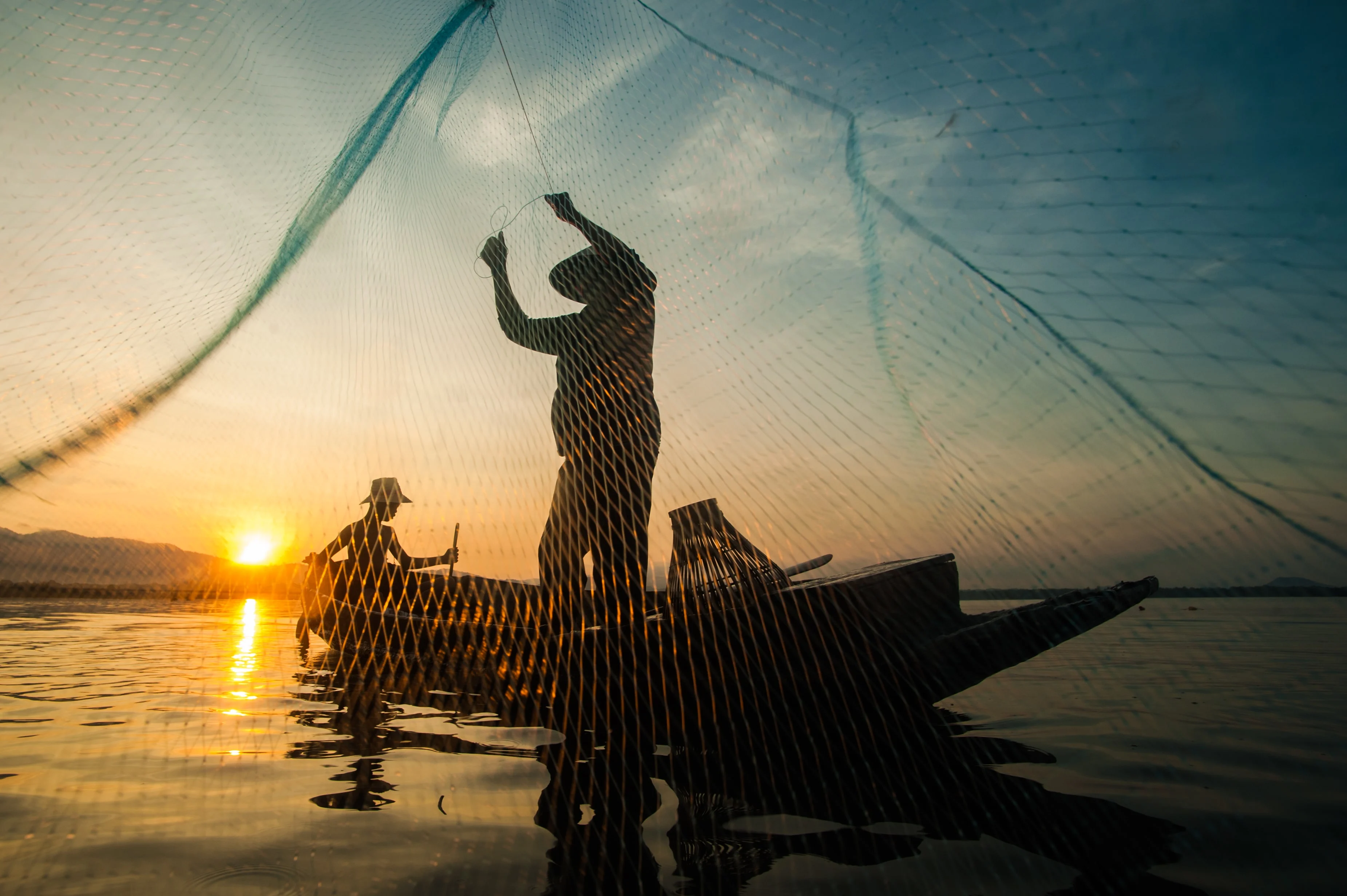Asian Fisherman On Wooden Boat Casting A Net For C 2025 01 09 19 59 57 Utc Min